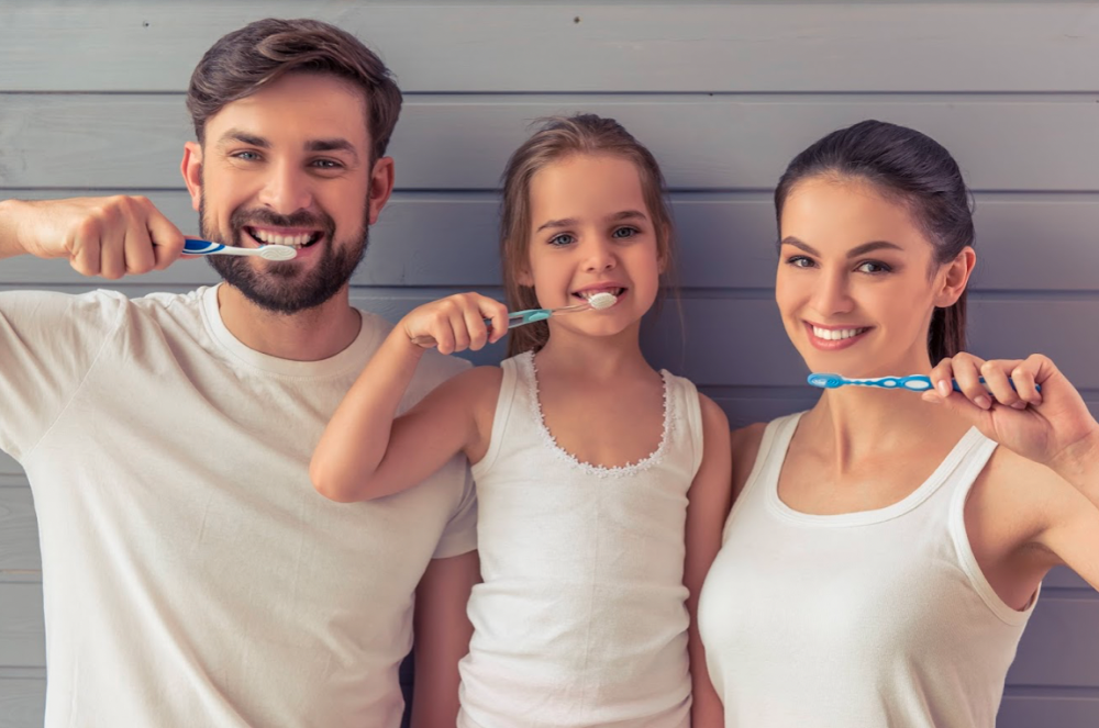 3 people doing brush